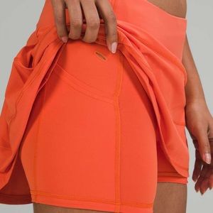 Lulu lemon tennis skirt bright warm coral in size 6 Tall
